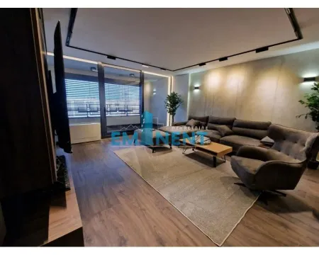 Modernly furnished living room with sofa set and TV. - image 2