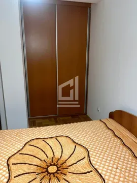 Bedroom with a bed and a fitted wardrobe. - image 4