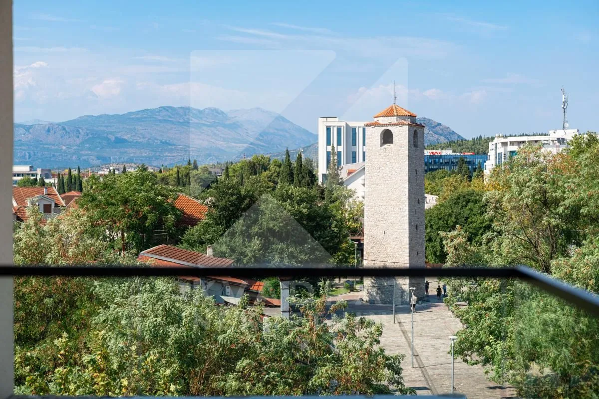 View from the terrace of the city and surrounding mountains.