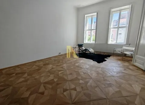 Empty room with parquet flooring and two windows. - image 12