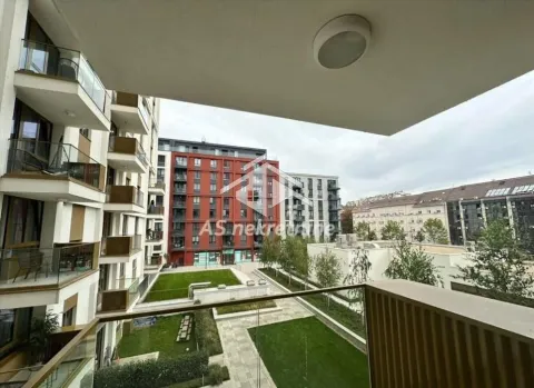 View from the balcony overlooking the courtyard and surrounding complex buildings. - image 8