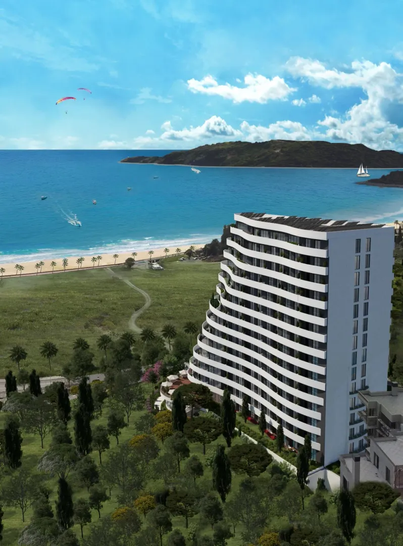 3D prikaz moderne stambene zgrade na obali mora okružene zelenilom.
