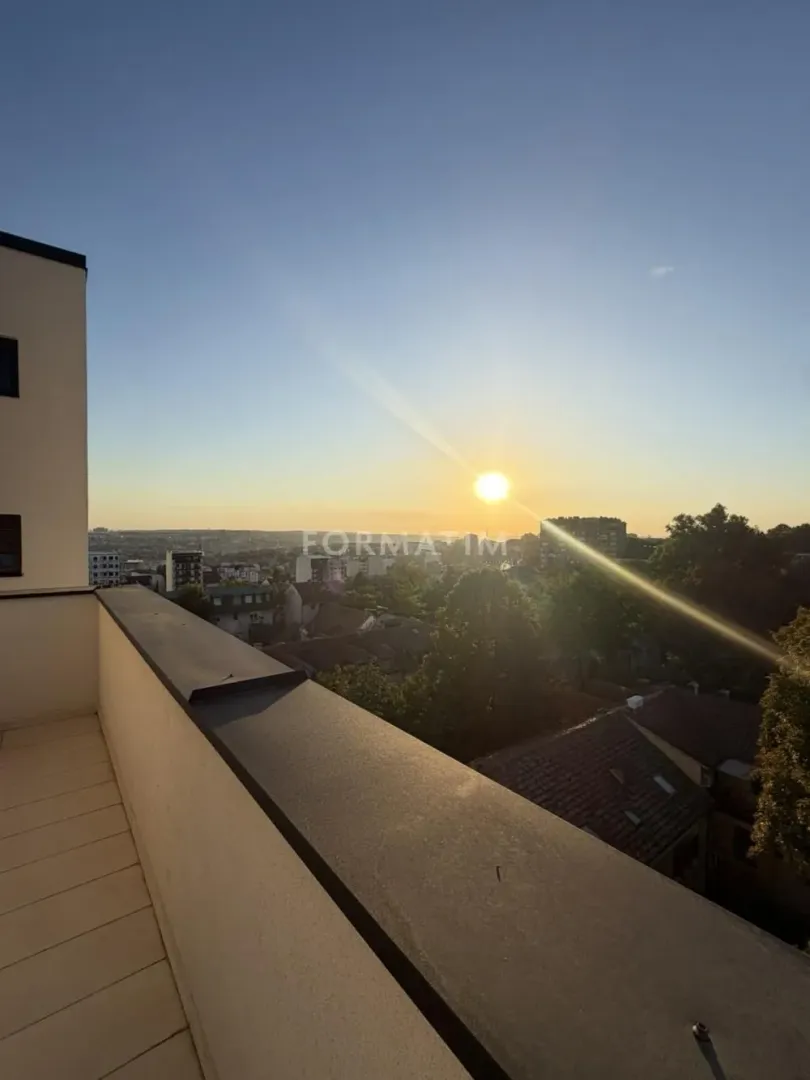 View of the city from the terrace during sunset.