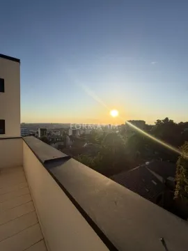 View of the city from the terrace during sunset. - image 6