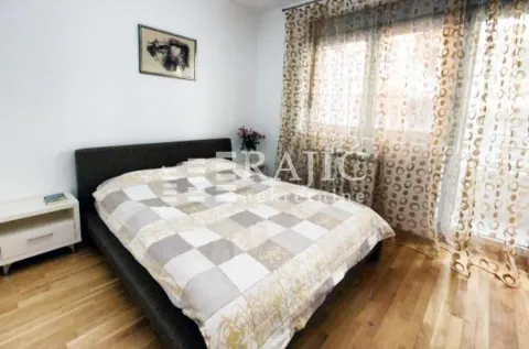 Furnished bedroom with a double bed and a window. - image 14