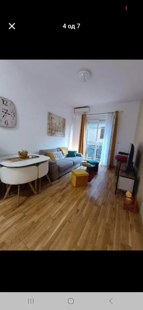 Living room with a dining area and access to the terrace.