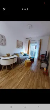 Living room with a dining area and access to the terrace. - image 3