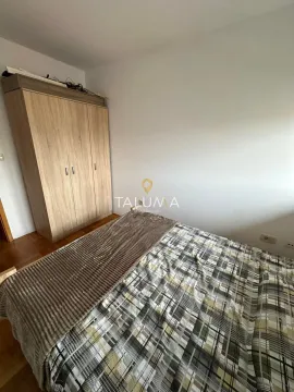 Bedroom with a double bed and a wooden wardrobe. - image 8
