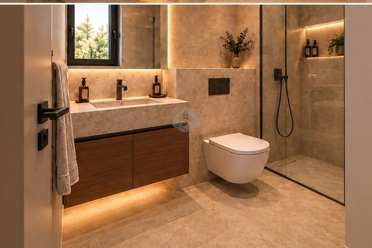 Modern bathroom with a built-in basin, wall-hung toilet, and walk-in shower.