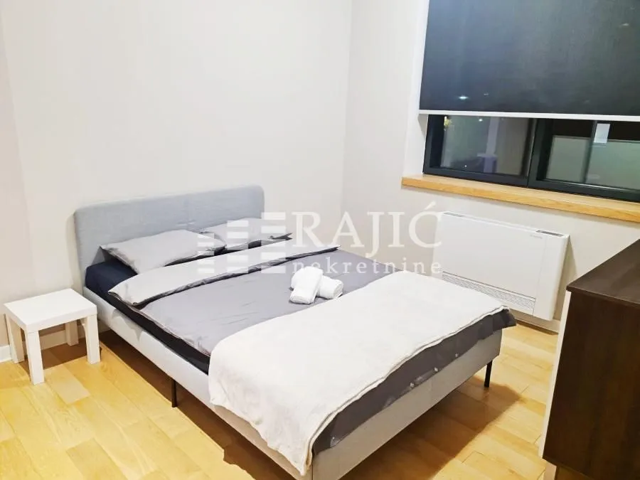 Furnished bedroom with a double bed.