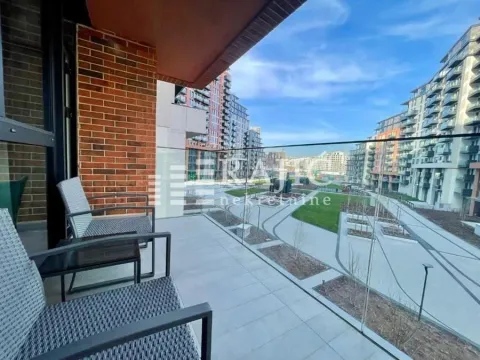 Modern spacious balcony with seating furniture and a view of the neighborhood. - image 10