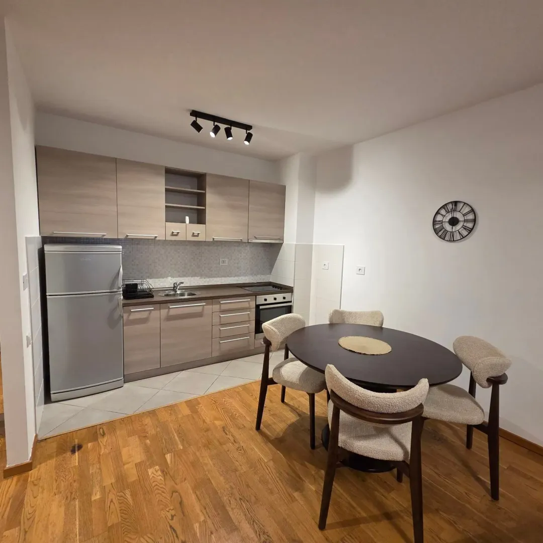 Kitchen with a dining table and chairs.