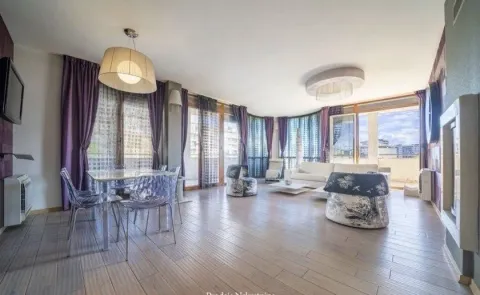 Spacious and bright living room with dining area and terrace access. - image 2