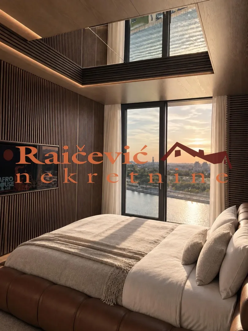 Modern bedroom with a large double bed and river view.