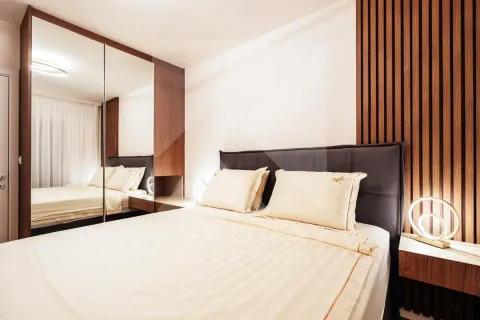 Modern bedroom with a double bed, mirrored built-in wardrobe, and wooden wall panels. - image 4