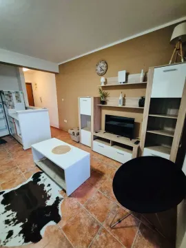 Furnished living room with TV unit and coffee table. - image 2