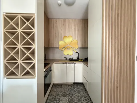 Modern kitchen with wooden elements and built-in appliance. - image 5