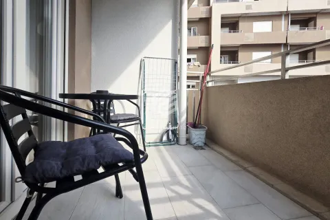 Furnished balcony with a table and chairs. - image 13