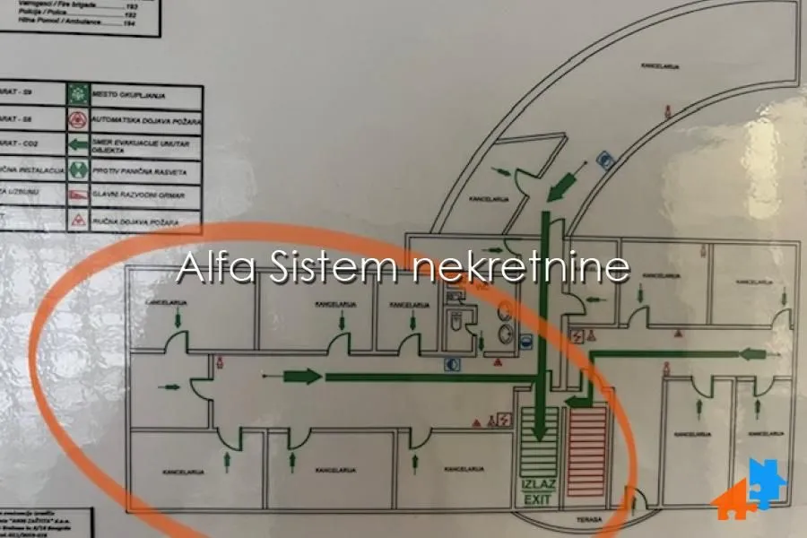 Floor plan showing evacuation routes and room layout.