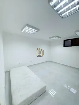 Empty room with white walls, tiled floors, and a mattress on the floor. - image 11
