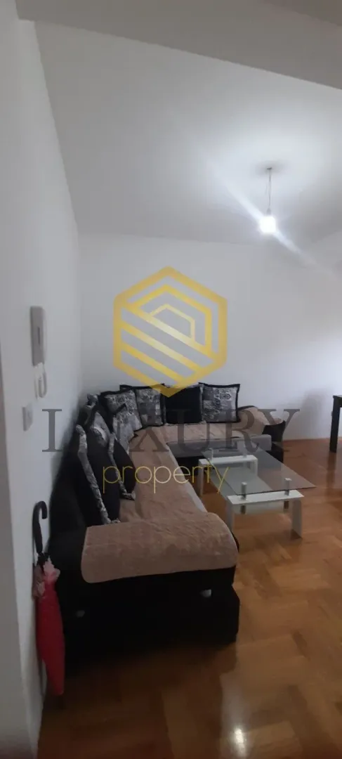 Living room with a sectional sofa and a coffee table.