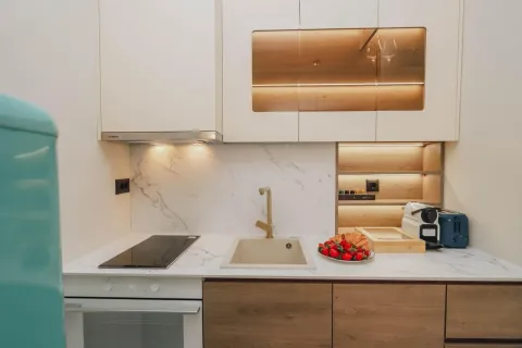 Modern kitchen with white and wooden elements. - image 5