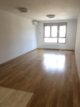 Empty room with wooden flooring and a window. - image 11