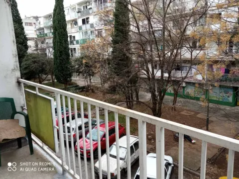 View from the balcony overlooking the courtyard and neighboring residential buildings. - image 15