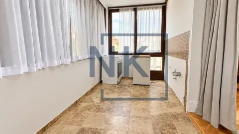 Small kitchen with tiled flooring and a large window. - image 8