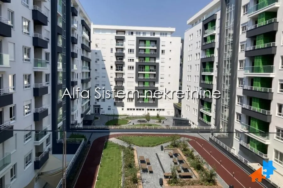View of the courtyard and surrounding residential buildings from the balcony.
