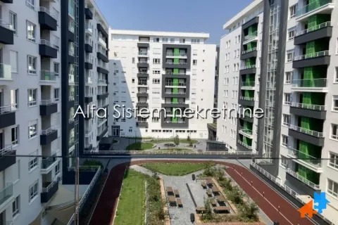 View of the courtyard and surrounding residential buildings from the balcony. - image 20