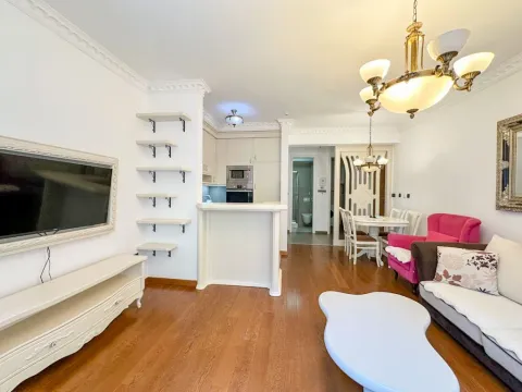 Spacious living room with a dining area and a view of the kitchen. - image 4