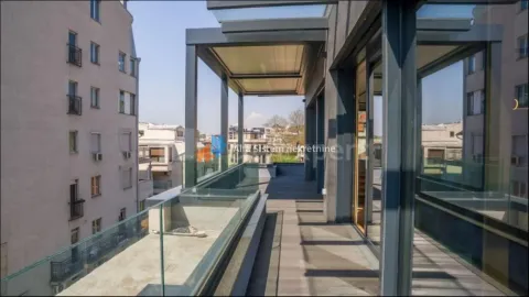 Spacious covered terrace with wooden flooring and a view of surrounding buildings. - image 22