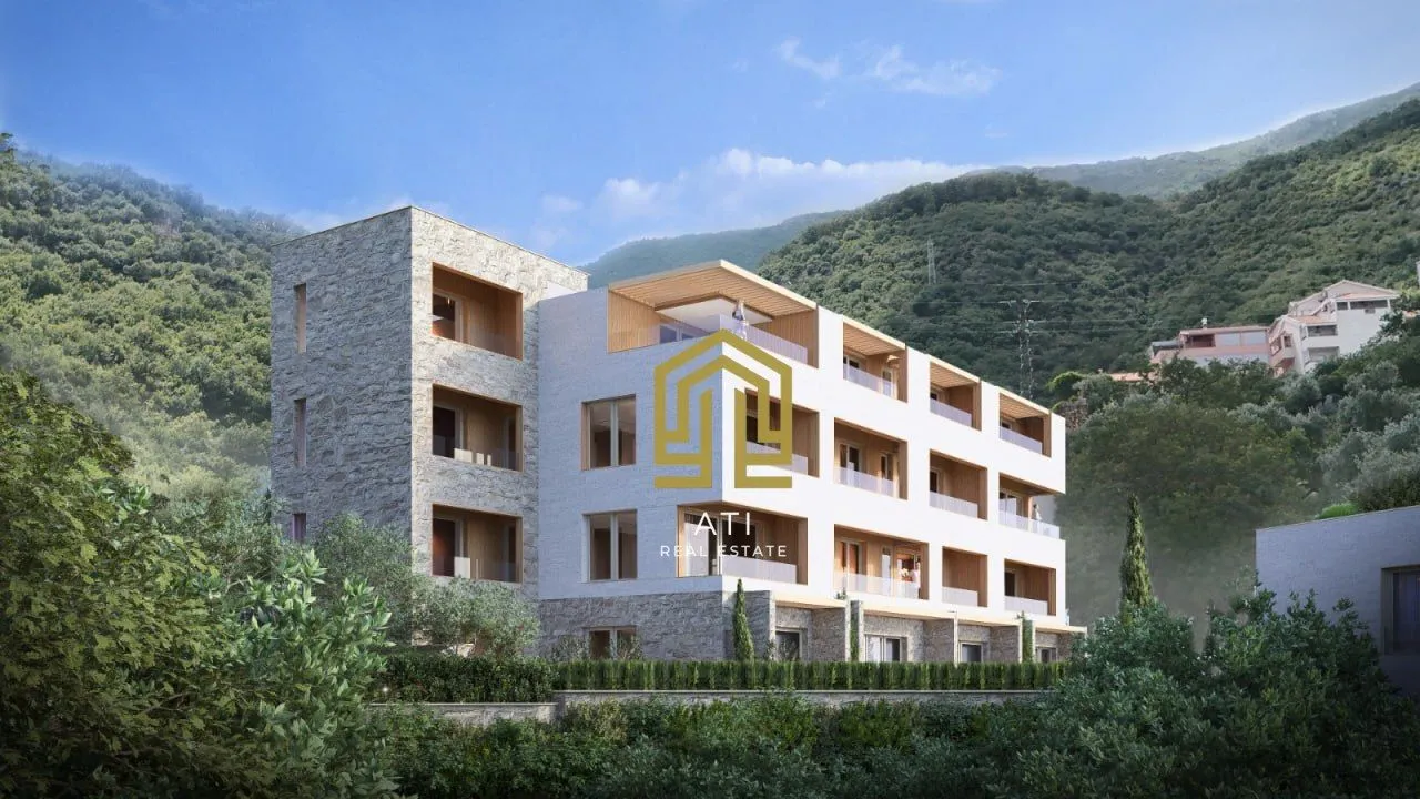 Eksterijer moderne stambene zgrade okružene zelenilom.