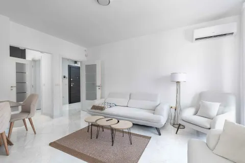 Bright and modernly furnished living room with a sofa set. - image 6