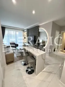 Modern living room with a dining area and a kitchen bar. - image 4