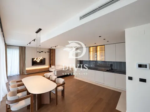 Spacious open-plan living room with dining area and kitchen. - image 6