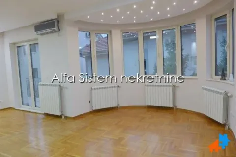 Empty living room with parquet flooring, radiators, and large windows set in a semicircular wall. - image 8