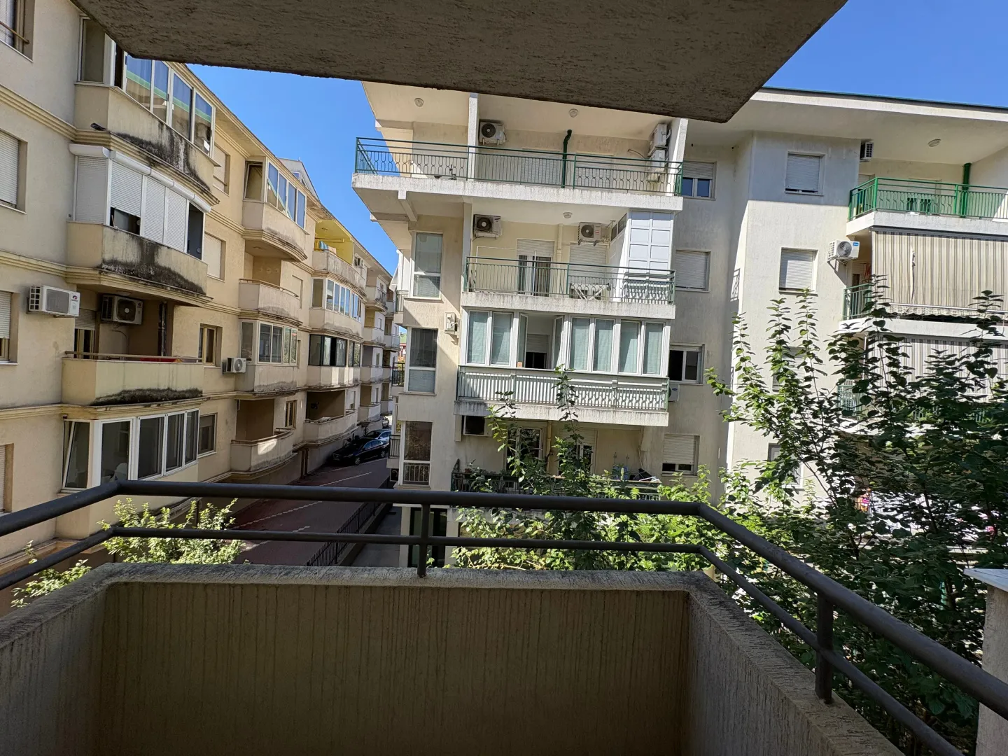 View from the balcony overlooking surrounding residential buildings.
