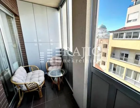 Glazed terrace with seating furniture and a city view. - image 13