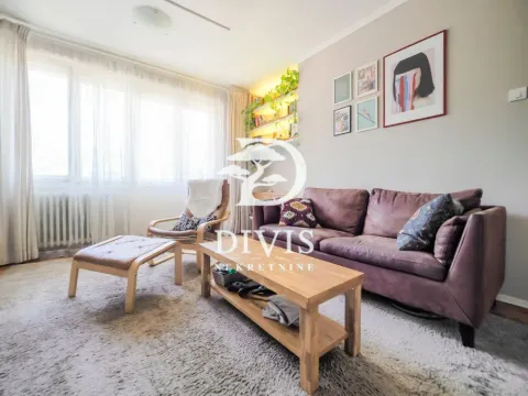 Living room with a sofa, armchair and wooden coffee table by the window. - image 9