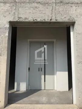 View of the building entrance with an elevator. - image 10