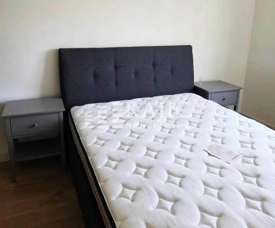 Bedroom with a double bed and bedside tables.