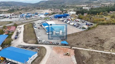 Aerial view of a business complex with warehouses and parking for freight vehicles. - image 7