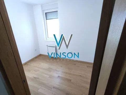 Empty room with hardwood flooring and white walls. - image 10