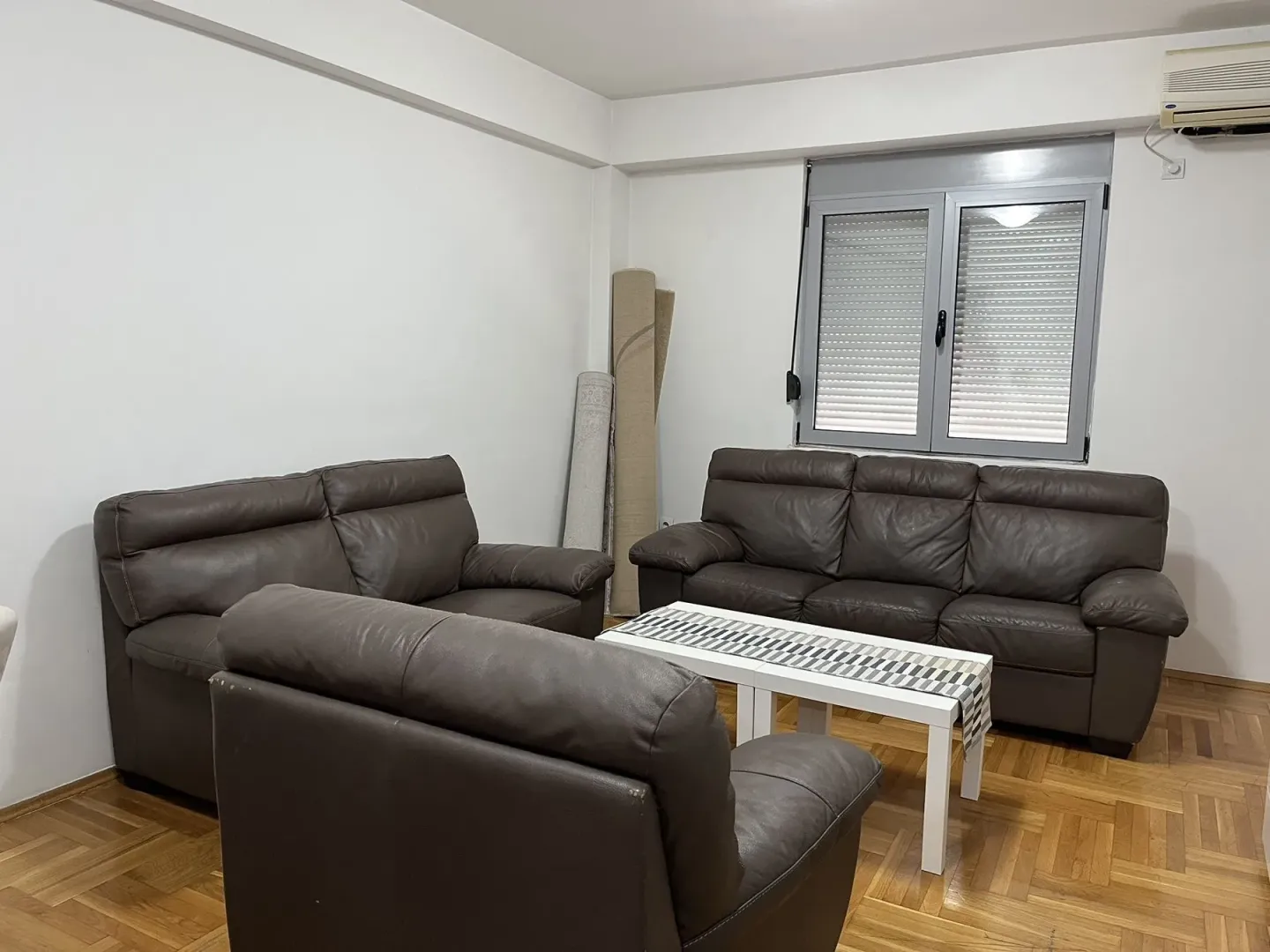 Living room with leather furniture.