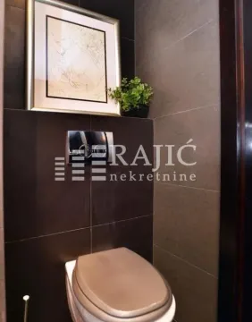 Modernly equipped bathroom with dark tiles and built-in sanitaryware. - image 8