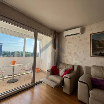Living room with furniture and access to the terrace. - image 4