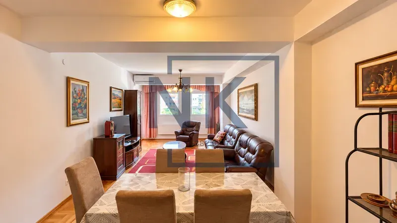 Living room with a dining area and seating furniture.