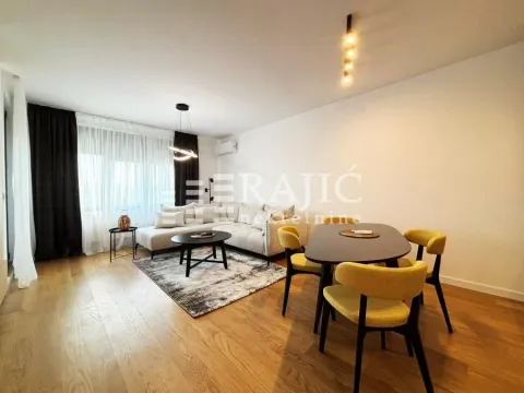 Spacious living room with a sofa set and dining table. - image 4